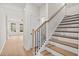 Staircase with wood treads and iron balusters, blending elegance and modern design at 1024 Rose Dr, Marietta, GA 30060