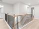 Bright staircase features wood treads and black iron balusters at 1024 Rose Dr, Marietta, GA 30060