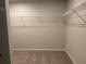 Neutral walk-in closet with carpet and wire shelving for customizable storage and organization at 1024 Rose Dr, Marietta, GA 30060