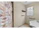 Bathroom featuring a shower, toilet, and a sink with tile flooring at 1256 Melrose Forrest Ln, Lawrenceville, GA 30045