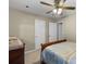 Spacious bedroom with carpet, ceiling fan, and a large dresser at 1256 Melrose Forrest Ln, Lawrenceville, GA 30045