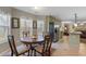 Breakfast nook with wooden table set has windows overlooking the outside at 1256 Melrose Forrest Ln, Lawrenceville, GA 30045