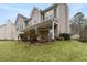 Charming two-story home with a covered front porch and well-manicured lawn at 1256 Melrose Forrest Ln, Lawrenceville, GA 30045