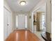 Inviting foyer with hardwood floors, white door, and natural light at 1256 Melrose Forrest Ln, Lawrenceville, GA 30045