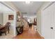 Hardwood hallway with staircase leading to the second floor at 1256 Melrose Forrest Ln, Lawrenceville, GA 30045