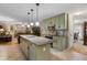 Well-lit kitchen features a speckled granite countertop island with pendant lights at 1256 Melrose Forrest Ln, Lawrenceville, GA 30045