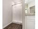 Bright bathroom featuring a shower stall, vinyl floors, a granite countertop vanity and neutral colors at 1508 Burberry Aly, Marietta, GA 30008