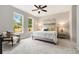 Bright bedroom with a ceiling fan, large windows and neutral color scheme, creating a peaceful retreat at 1508 Burberry Aly, Marietta, GA 30008