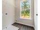 Bright laundry room with hookups and a large window offering a view of the backyard at 1508 Burberry Aly, Marietta, GA 30008