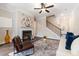 Cozy living room with fireplace, ceiling fan, and staircase at 1508 Burberry Aly, Marietta, GA 30008