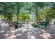 Tree-lined brick walking path with benches and green space in a manicured park at 1508 Burberry Aly, Marietta, GA 30008