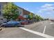 Street view of older buildings and businesses with parked cars on the side of the road at 1508 Burberry Aly, Marietta, GA 30008