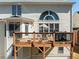 View of the deck with dining furniture, and the home's backyard at 2986 Nestle Creek Dr, Marietta, GA 30062