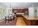 Dining area with a chandelier, hardwood floors, and natural light from surrounding windows at 2986 Nestle Creek Dr, Marietta, GA 30062