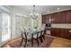 Dining area with chandelier lighting, hardwood floors, and access to the backyard at 2986 Nestle Creek Dr, Marietta, GA 30062