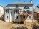 View of the home's back facade, patio, and yard at 2986 Nestle Creek Dr, Marietta, GA 30062