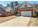 Beautiful brick home with a two-car garage, well-maintained landscaping, and a neatly paved driveway at 2986 Nestle Creek Dr, Marietta, GA 30062