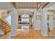 Grand foyer with hardwood floors, staircase, and views into the living room with lots of natural light at 2986 Nestle Creek Dr, Marietta, GA 30062