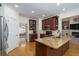 Kitchen featuring an island with a granite countertop and an open view to the living room at 2986 Nestle Creek Dr, Marietta, GA 30062