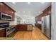 Modern kitchen with stainless steel appliances, granite countertops, and hardwood floors at 2986 Nestle Creek Dr, Marietta, GA 30062