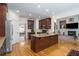 Kitchen island with granite countertops and an adjacent doorway to an adjoining living room at 2986 Nestle Creek Dr, Marietta, GA 30062