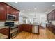 Modern kitchen with stainless steel appliances, granite countertops, and custom cabinetry at 2986 Nestle Creek Dr, Marietta, GA 30062