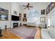 Spacious living room featuring a fireplace, high ceilings, large windows, and hardwood floors at 2986 Nestle Creek Dr, Marietta, GA 30062