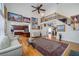 Spacious living room features hardwood floors, a ceiling fan, and an open staircase at 2986 Nestle Creek Dr, Marietta, GA 30062