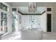 Bright bathroom features a soaking tub, radiant chandelier and glass-enclosed shower with multiple shower heads at 388 Beverly Ne Rd, Atlanta, GA 30309