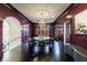 Elegant dining room featuring a modern chandelier, dark wood floors and a circular table with stylish chairs at 388 Beverly Ne Rd, Atlanta, GA 30309