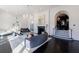 Bright and airy living room featuring a fireplace, chandelier, and large windows providing natural light at 388 Beverly Ne Rd, Atlanta, GA 30309