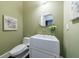 Charming powder room with soft green walls, modern fixtures, and floral accents at 388 Beverly Ne Rd, Atlanta, GA 30309