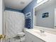 Bathroom with a shower-tub combination, white tiles, and a pedestal sink at 69 New Brunswick Ct, Suwanee, GA 30024