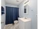 Blue bathroom featuring a walk in shower, a modern sink, and neutral color paint at 69 New Brunswick Ct, Suwanee, GA 30024