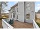 Outdoor deck featuring wood flooring, white railings, and a table with seating at 69 New Brunswick Ct, Suwanee, GA 30024