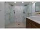 Elegant bathroom featuring a double walk-in shower with rain shower heads and a vessel sink at 8404 Majors Rd, Cumming, GA 30041