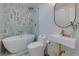 Modern bathroom featuring a sleek bathtub, stylish tile work, and contemporary fixtures, creating a spa-like retreat at 8404 Majors Rd, Cumming, GA 30041