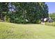 Large, grassy backyard; bordered with mature trees at 1590 Greyson Rdg, Marietta, GA 30062