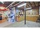 Basement area featuring shelving, workbench, pegboard storage and concrete floor at 1590 Greyson Rdg, Marietta, GA 30062