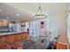 Bright dining area adjacent to the kitchen, featuring a modern chandelier and ample natural light at 1590 Greyson Rdg, Marietta, GA 30062