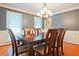 Cozy dining room with a hardwood floor, a chandelier, and lots of light coming in at 1590 Greyson Rdg, Marietta, GA 30062