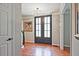 Stunning foyer featuring hardwood floors, elegant lighting, and stylish double doors at 1590 Greyson Rdg, Marietta, GA 30062