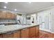 Spacious kitchen featuring a granite island, stainless steel appliances, and a separate pantry at 1590 Greyson Rdg, Marietta, GA 30062