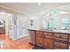 Kitchen with a granite island, stainless steel dishwasher, and unique windows offering natural light at 1590 Greyson Rdg, Marietta, GA 30062