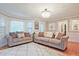 Spacious living room with plush seating, a patterned rug, and natural light at 1590 Greyson Rdg, Marietta, GA 30062