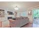 Inviting living room with built-in shelving, fireplace, and access to the outdoor deck at 1590 Greyson Rdg, Marietta, GA 30062