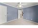 Bedroom with a ceiling fan, and neutral colored walls at 3595 Ansley Park Dr, Suwanee, GA 30024