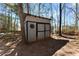 Backyard shed offering convenient storage, enhancing the functionality of the property at 3595 Ansley Park Dr, Suwanee, GA 30024