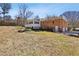 View of a brick two-story home with a large backyard and fenced-in area, perfect for pets and  at 663 Foxcroft Circle Se, Marietta, GA 30067