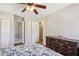 Bedroom with hardwood floors, a floral comforter, and dresser at 663 Foxcroft Circle Se, Marietta, GA 30067